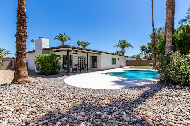 5211 E Winchcomb Dr, Scottsdale, AZ 85254 - rear view of property with a ceiling fan, a patio area, a fenced backyard, and a chimney