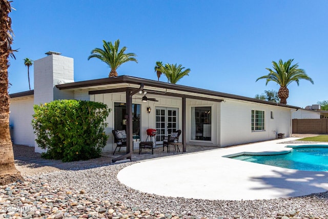 5211 E Winchcomb Dr, Scottsdale, AZ 85254 - rear view of house featuring a patio, a ceiling fan, and a chimney