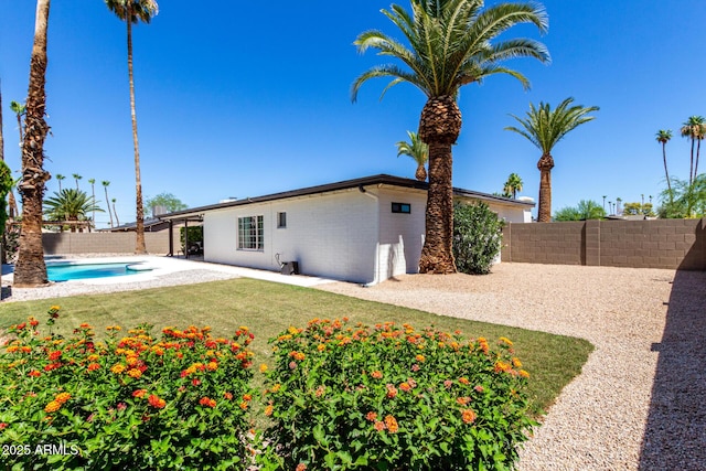 5211 E Winchcomb Dr, Scottsdale, AZ 85254 - rear view of property with a fenced backyard, brick siding, and a patio area