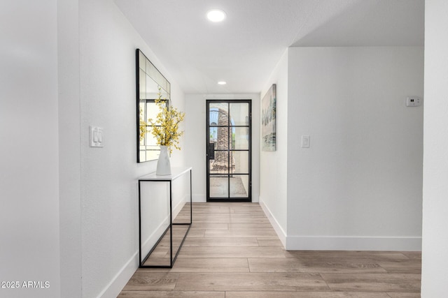 5211 E Winchcomb Dr, Scottsdale, AZ 85254 - hallway with light wood finished floors and recessed lighting