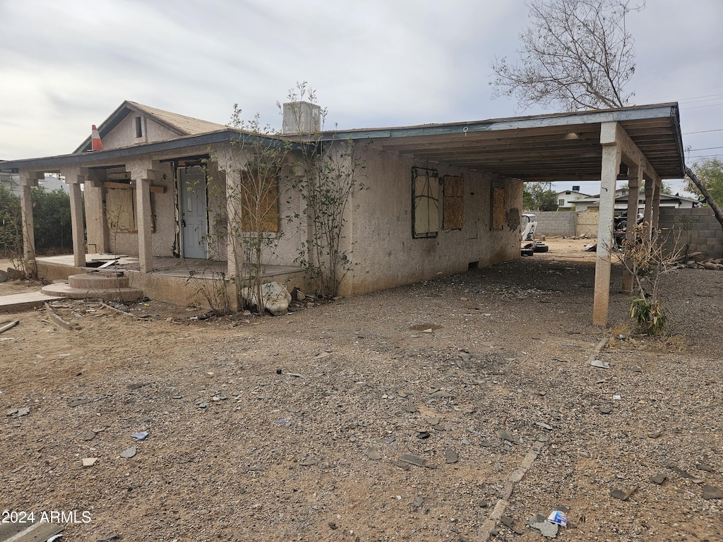 view of front of house with a carport