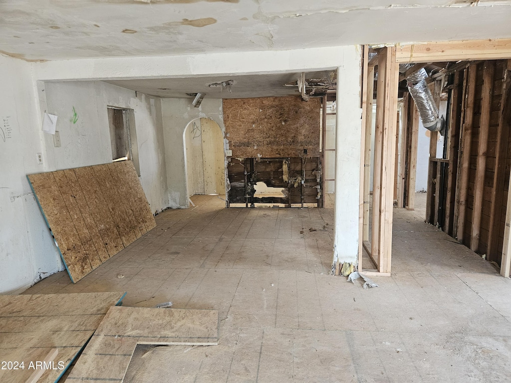 miscellaneous room featuring a stone fireplace