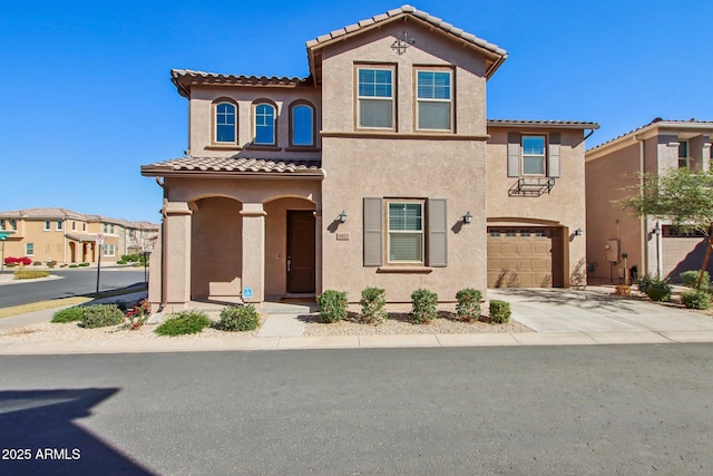 mediterranean / spanish-style home with a garage