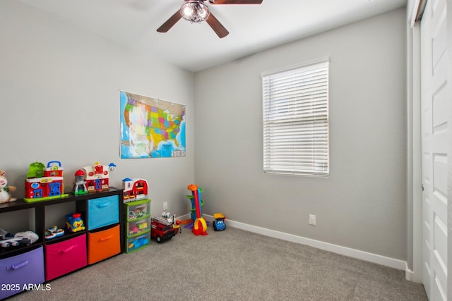 playroom featuring carpet and ceiling fan