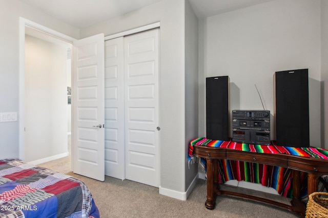 carpeted bedroom with a closet