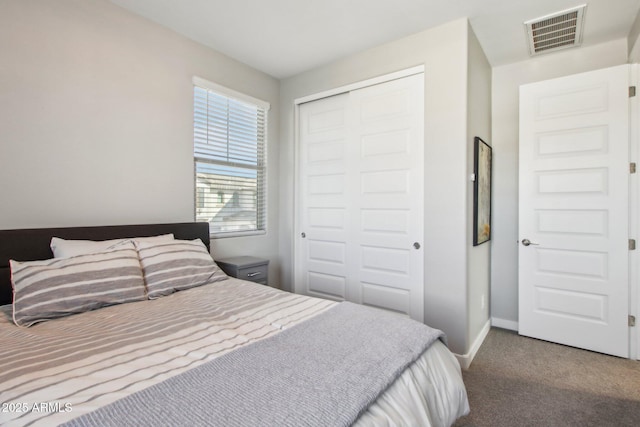 bedroom featuring a closet and carpet floors