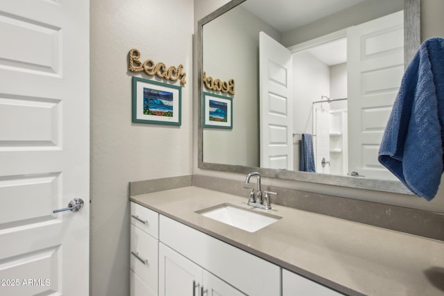 bathroom featuring vanity and walk in shower