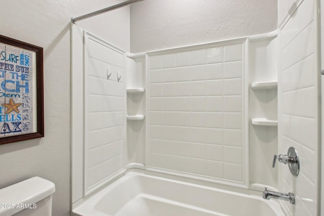 bathroom with toilet and  shower combination