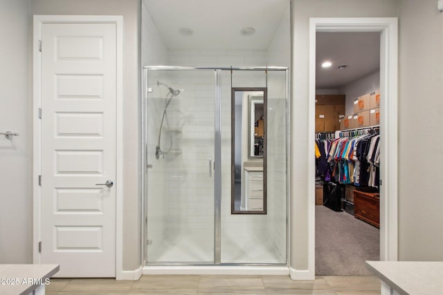 bathroom featuring vanity and an enclosed shower