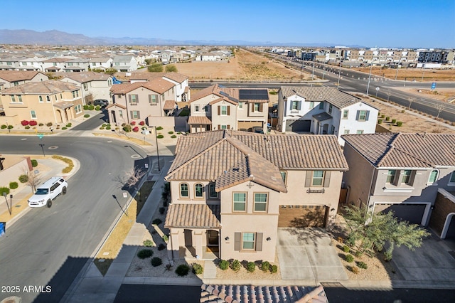 birds eye view of property with a mountain view