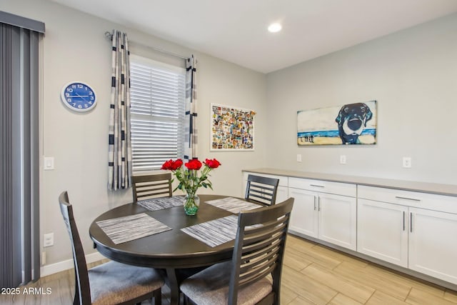 dining space with light hardwood / wood-style floors