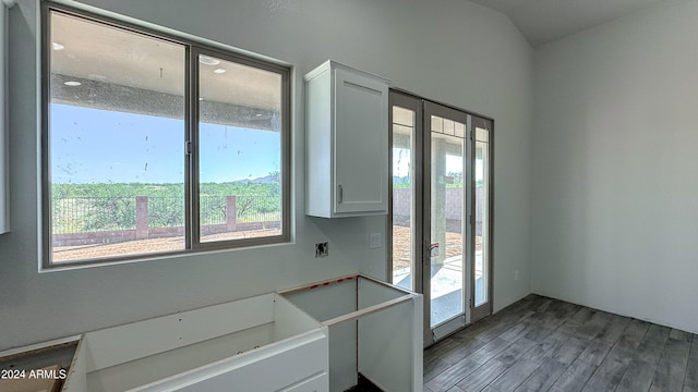 kitchen featuring white cabinetry and wood finished floors