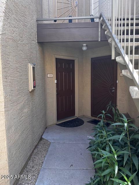 2228 N 52nd St Unit 140, Phoenix, AZ 85008 - doorway to property featuring stucco siding