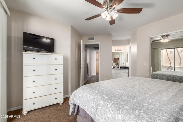 2228 N 52nd St Unit 140, Phoenix, AZ 85008 - bedroom with dark colored carpet and ceiling fan