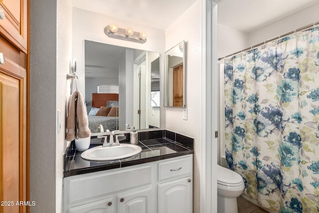 2228 N 52nd St Unit 140, Phoenix, AZ 85008 - ensuite bathroom featuring vanity, tile patterned flooring, and a shower with shower curtain