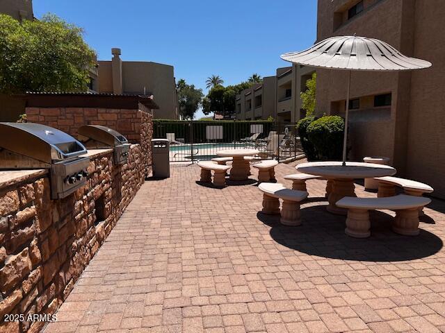 2228 N 52nd St Unit 140, Phoenix, AZ 85008 - view of patio / terrace with a community pool