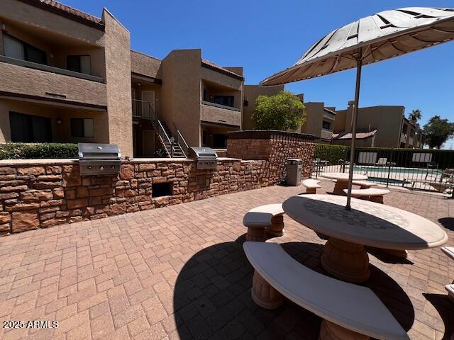 2228 N 52nd St Unit 140, Phoenix, AZ 85008 - view of patio with a community pool