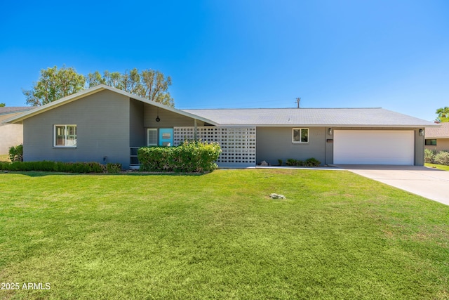 view of front facade featuring a garage, concrete driveway, and a front yard