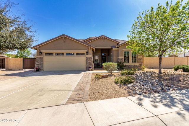 view of front of property with a garage, concrete driveway, stone siding, and stucco siding