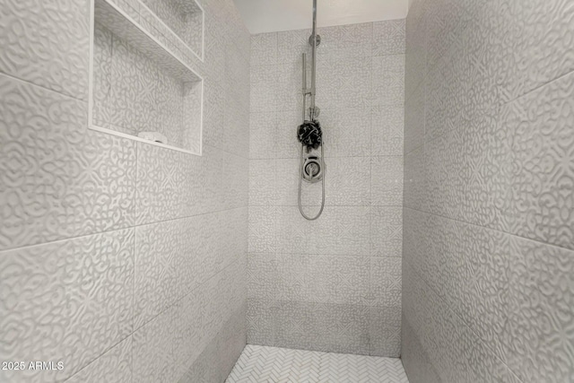 full bathroom with a tile shower