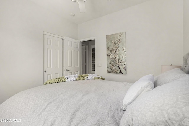 bedroom featuring ceiling fan and a closet