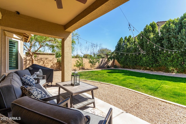 view of patio / terrace with a fenced backyard, a grill, outdoor lounge area, and a ceiling fan