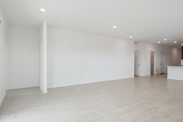 25425 W Graham Trl, Buckeye, AZ 85326 - unfurnished living room with recessed lighting and baseboards