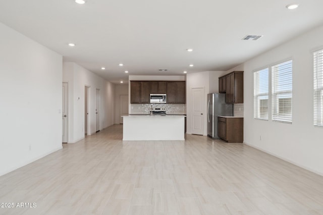 25425 W Graham Trl, Buckeye, AZ 85326 - unfurnished living room with visible vents and recessed lighting