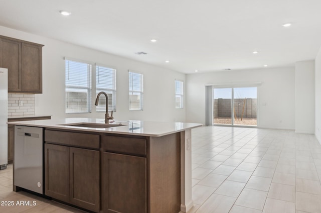 25425 W Graham Trl, Buckeye, AZ 85326 - kitchen with an island with sink, light countertops, a sink, stainless steel appliances, and open floor plan