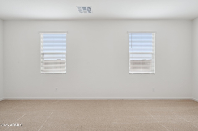 25425 W Graham Trl, Buckeye, AZ 85326 - unfurnished room with visible vents, light colored carpet, and baseboards