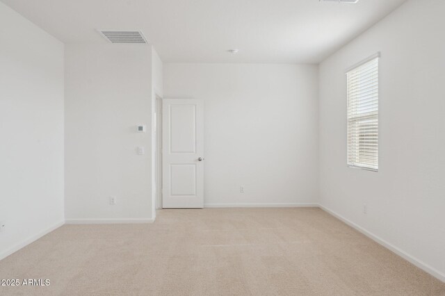 25425 W Graham Trl, Buckeye, AZ 85326 - unfurnished room with light colored carpet, baseboards, and visible vents