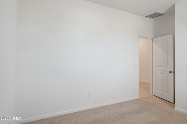 25425 W Graham Trl, Buckeye, AZ 85326 - spare room featuring visible vents, baseboards, and light carpet