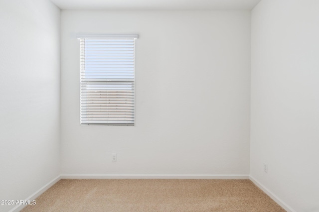 25425 W Graham Trl, Buckeye, AZ 85326 - spare room with baseboards and light colored carpet