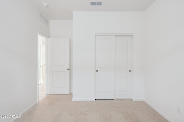 25425 W Graham Trl, Buckeye, AZ 85326 - unfurnished bedroom with light colored carpet, baseboards, and visible vents