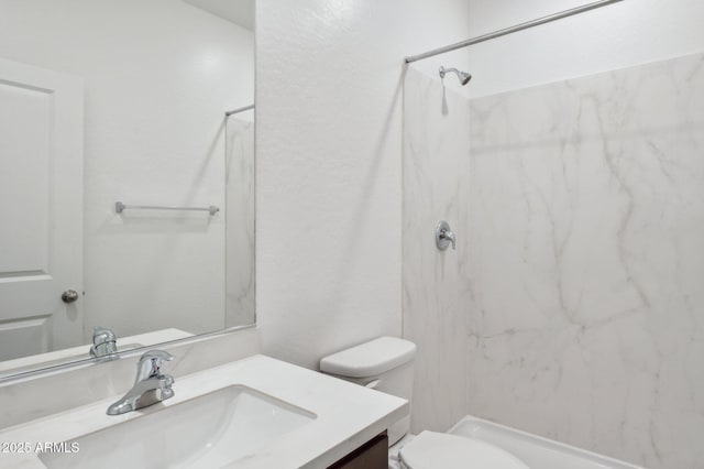 25425 W Graham Trl, Buckeye, AZ 85326 - bathroom featuring toilet, a marble finish shower, and vanity