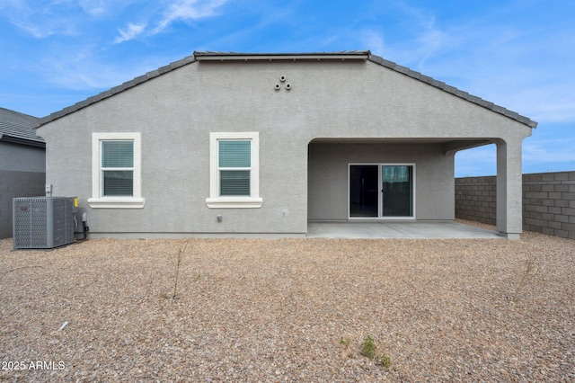 25425 W Graham Trl, Buckeye, AZ 85326 - rear view of property with a patio, central AC, fence, and stucco siding