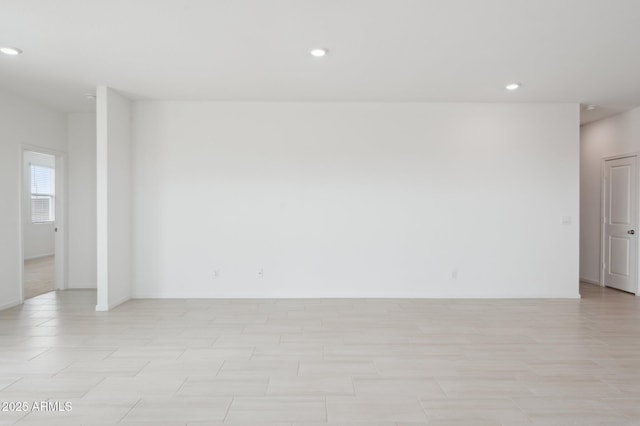 25425 W Graham Trl, Buckeye, AZ 85326 - empty room featuring baseboards and recessed lighting