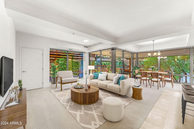 living room with an inviting chandelier