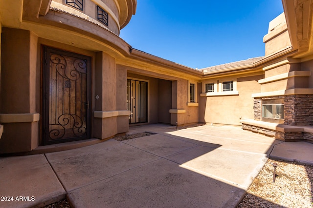 view of patio with an outdoor stone fireplace