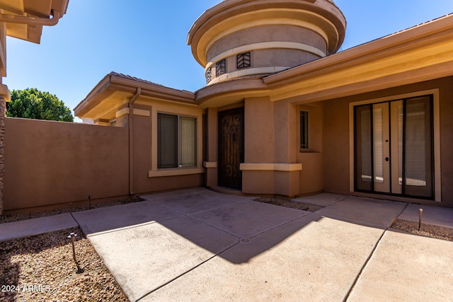 doorway to property featuring a patio