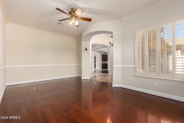 unfurnished living room with ceiling fan, dark hardwood / wood-style flooring, and ornamental molding