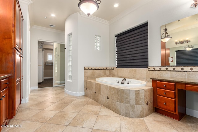 bathroom with tile patterned flooring, crown molding, and tiled tub