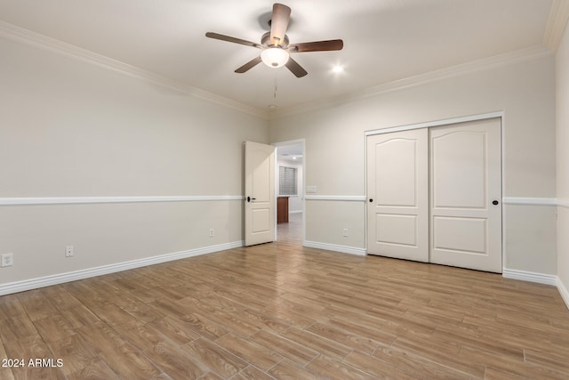 unfurnished bedroom featuring ornamental molding, light hardwood / wood-style flooring, and ceiling fan