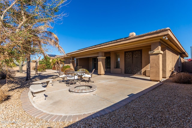 rear view of property with a patio area