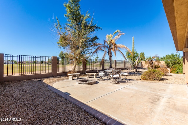 view of patio featuring a fire pit