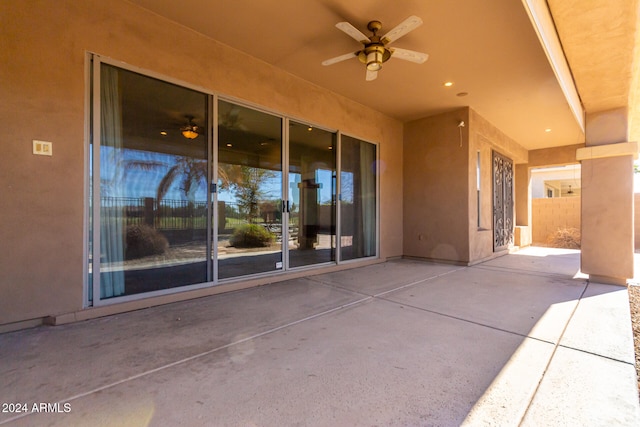 view of patio featuring ceiling fan