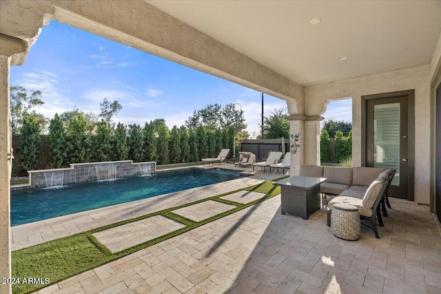 view of swimming pool featuring an outdoor hangout area, pool water feature, and a patio area