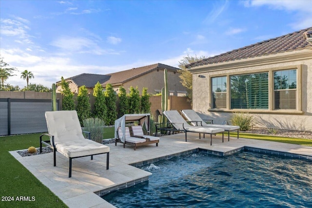 view of swimming pool featuring a patio