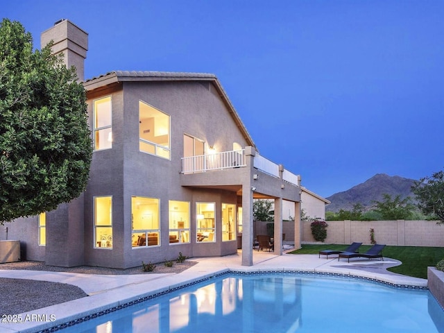9571 E Nittany Dr, Scottsdale, AZ 85255 - back of property featuring a balcony, a patio, stucco siding, and a mountain view