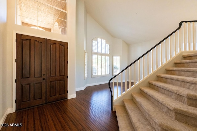 9571 E Nittany Dr, Scottsdale, AZ 85255 - entrance foyer with high vaulted ceiling, dark wood finished floors, and stairway